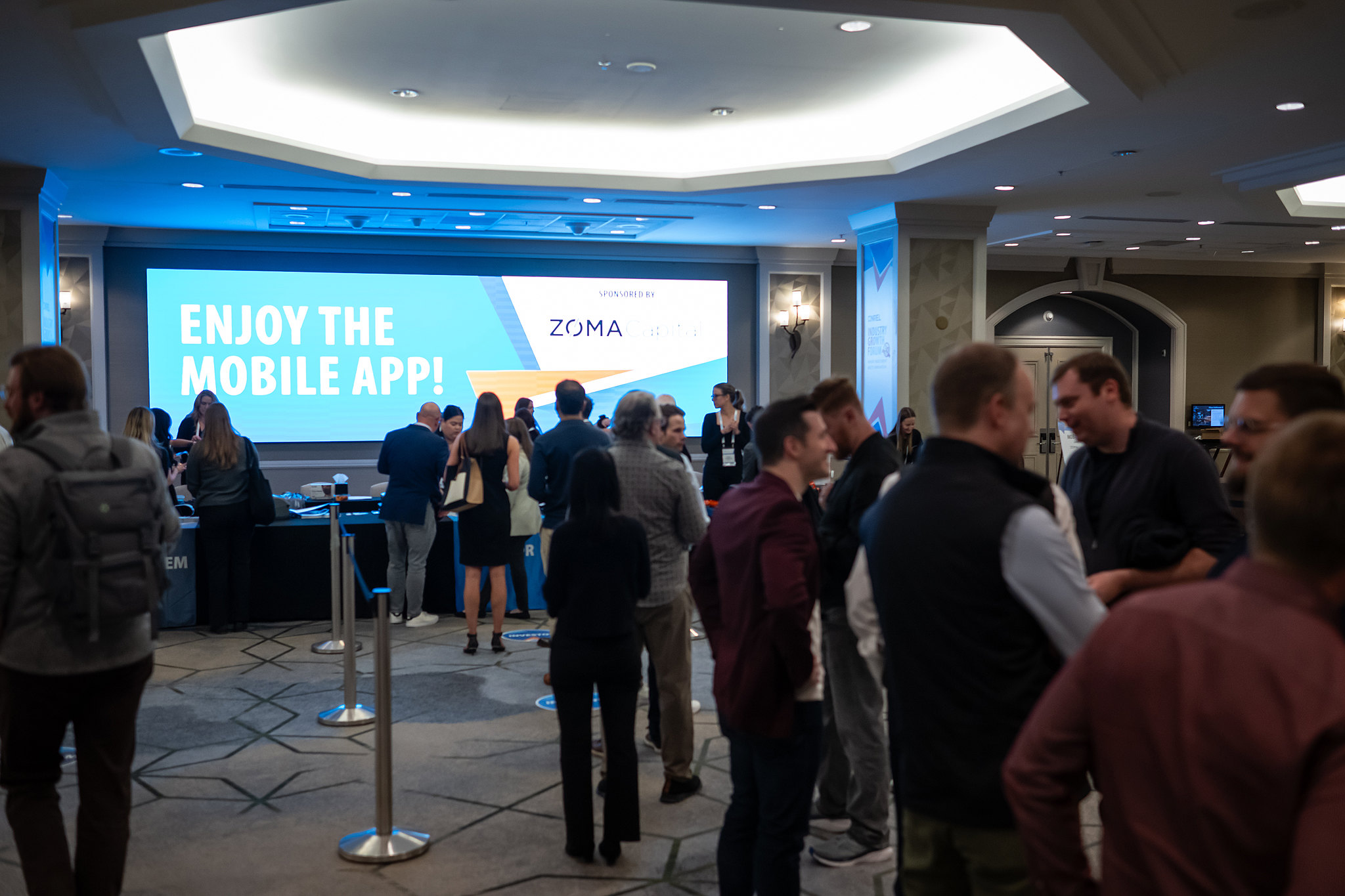 crowded room of people talking