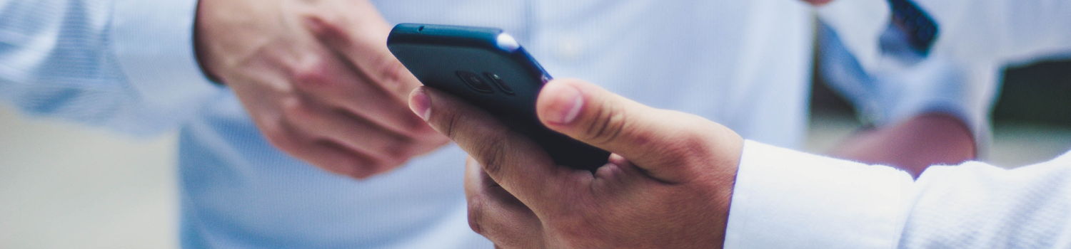 Man holding mobile device
